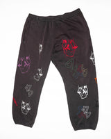 ABnormal Gallery black sweatpants with multicolored embroidered face motifs and glow-in-the-dark details